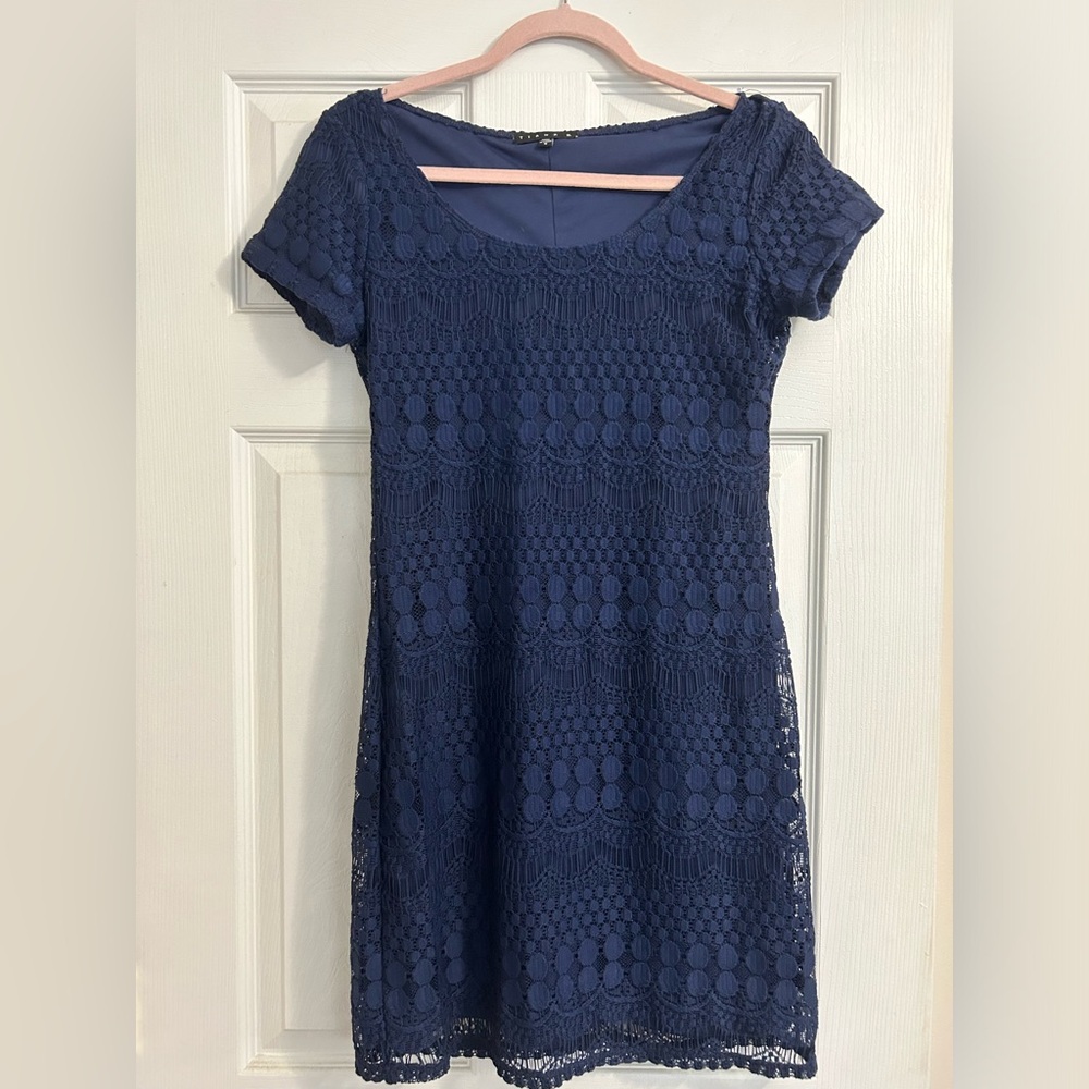 Body-con dress with lace overlay.